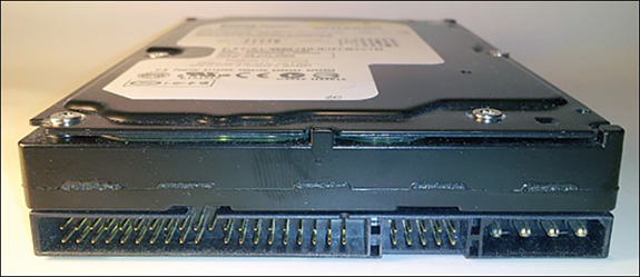 Photograph displays the back of an Integrated Drive Electronics interface on a hard disk, which is used to connect to CPU. The IDE interface, jumpers, and power connectors are observed.