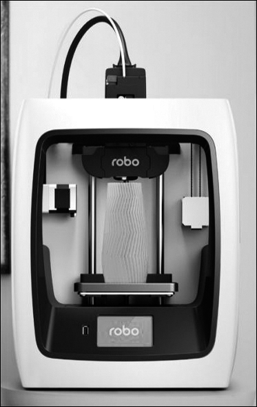 A photograph of the 3D printer is shown. It consists of two vertical bars fixed at both ends. The bars are attached to a print bed at the bottom.