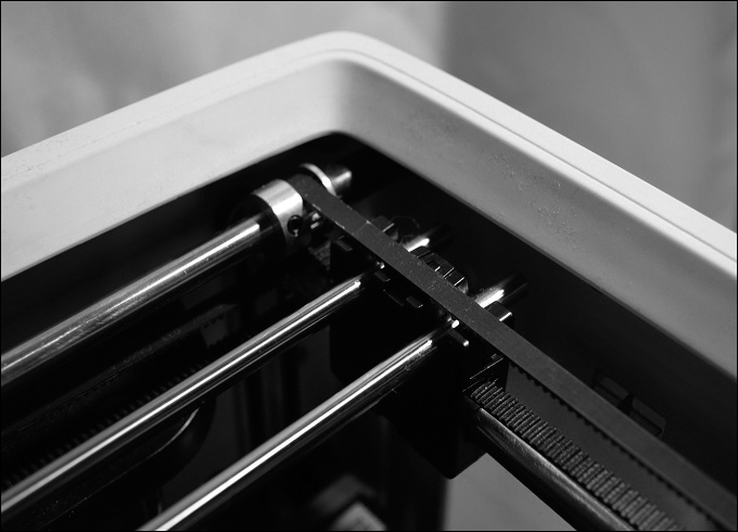 A photograph shows three axis bar in a 3D printer, which are thin cylindrical bars.