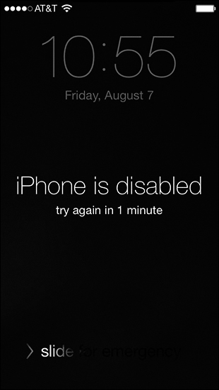 The lock screen of an iPhone is shown with date and time. A text below this reads, "iPhone is disabled, try again in 1 minute." The "slide for emergency" is at the bottom.