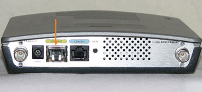 The back panel of a wireless access point device has many ports, the PoE port is highlighted.