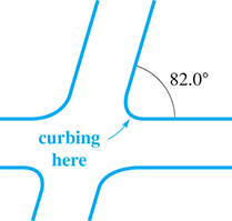 Two roads meet at curved curbing at 82.0 degrees.