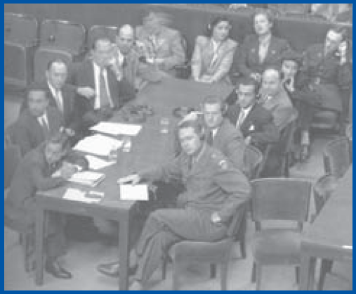 Telford Taylor (right front), formerly head of Special Branch liaison with London, now a brigadier general, pictured with his staff at Nuremberg War Crimes Trials (Source: NARA)