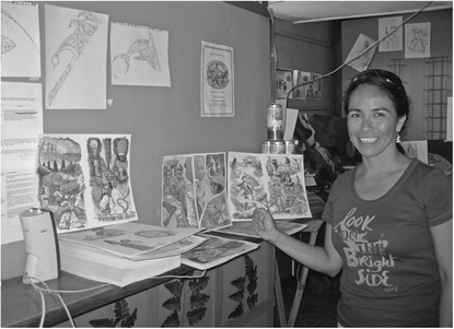 Figure 16.1 Annette Zamora with Drawings for the Comic Naz y Rongo Source: Leeatt Rothschild, May 2009.