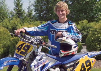 This environmental portrait is used as promotion for an aspiring professional motocross rider. Taken at ISO 100, f/14, 1/250 sec., with the Canon EF 100mm f/2.8 Macro USM lens.