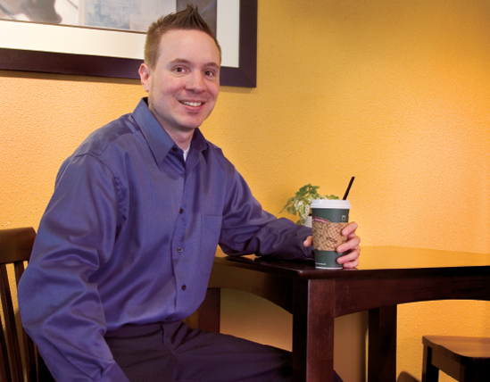 Part of a new local ice cream manufacturer business is a café that features ice cream, light meals, and coffee drinks. The company's marketing and sales manager is shown here.