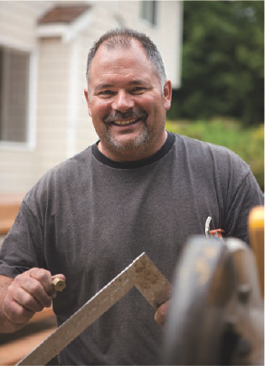 This environmental portrait of a building contractor was made in overcast light. Exposure: ISO 160, f/2.8, at 1/125 second using the EF 24-70mm f/2.8L USM lens.