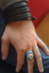 A close-up of the hand can highlight jewelry being worn.