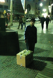 You can see some details in this image of a boy selling grapes in Spain on New Year’s Eve.