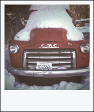 The truck in Polaroid instamatic film style.
