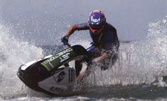 With a slightly slower shutter speed, such as 1/2000 second, you can use a smaller aperture for just a bit more depth of field. Here a sharp wake reinforces the effect of stopping the wave runner. Exposure at 1/2000 second, f/8.