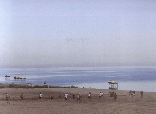 When the action is far away, like these athletes training on a beach, even 1/125 second can freeze it. Exposure at 1/125 second, f/11.