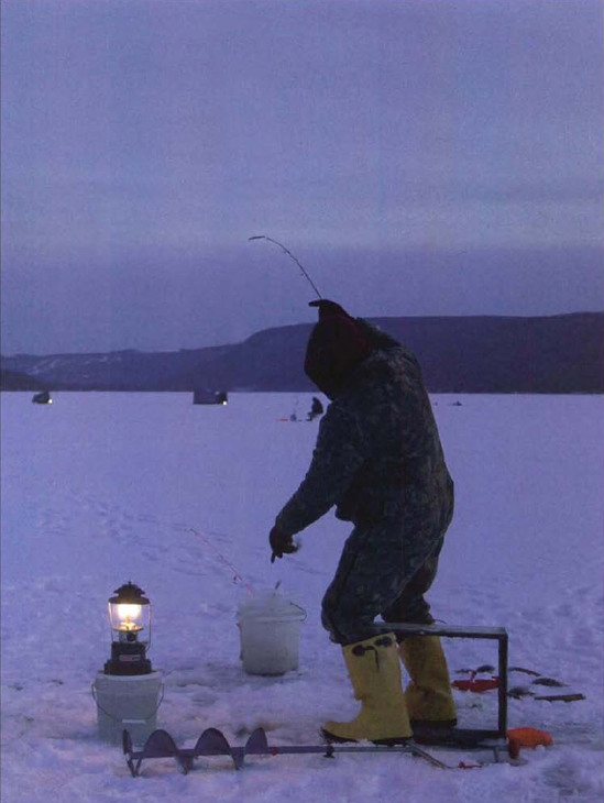 Brrr. My friend Gray Whelpley took this picture of an ice fisherman at twilight while we were putting together a travel photo book on New York State's Finger Lakes. Exposure at l/8 second, f/5.6. Photo © 2005 Gary Whelpley