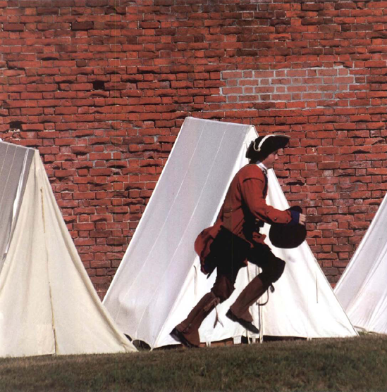 A re-enactor late for battle running to gut there in time. It seems like a simple picture but / purposefully tried to set him in front of one of the tents and hoped that I'd catch his legs pumping. Exposure at 1/1250 second, fl8.