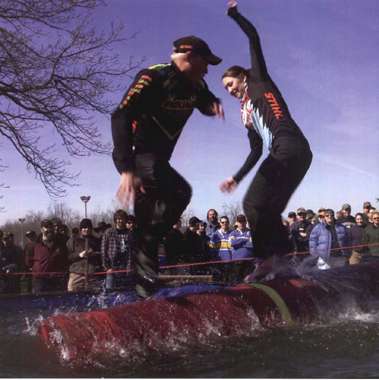 The blurred hands and feet combined with a whirling log show the precarious nature of these lag rollers. Exposure at 1/45 second, f/22.