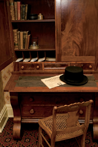 A desk and period pieces within the Petersen House (see C on the map). Taken at ISO 2000, f/4, 1/50 second with a 50mm lens and a flash bounced off the ceiling.