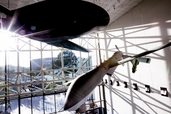 A Lockheed Martin/Boeing RQ-3A DarkStar (left) and a General Atomics Aeronautical Systems, Inc. MQ-1L Predator A in the Military Unmanned Aerial Vehicles exhibit at the National Air and Space Museum. Taken at ISO 800, f/20, 1/30 second with a 20mm lens.