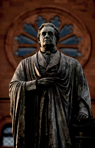 A statue of Joseph Henry, the first secretary of the Smithsonian Institution, in front of the Smithsonian Institution Building's north side (see B on the map). Taken at ISO 200, f/4, 1/200 second with a 180mm lens.