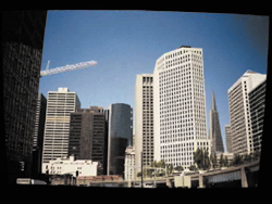 For an independent film with no budget set in San Francisco, the director had the clever idea of shooting it in a building lobby across the bay in lower-rent Oakland (13.6a), pulling a matte from the blue sky (13.6b), and match moving a still shot of the San Francisco skyline (from street level, 13.6c) for a result that anyone familiar with that infamous pyramid-shaped building would assume was taken in downtown San Francisco. (Images courtesy of The Orphanage.)