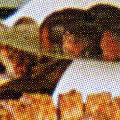 The rosette pattern visible in a halftone image, which can cause a moiré pattern when scanned.