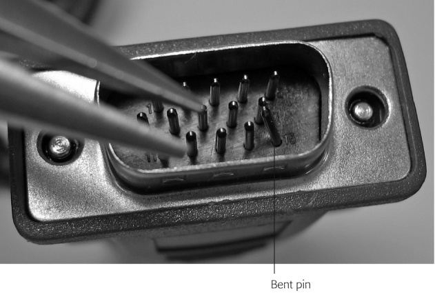 Sometimes a bent pin in a monitor’s cable connector keeps it from working properly. If you spot a bent pin, like this one on the plug’s bottom right, use a pair of needle-nose pliers to straighten it back in line with the rest of its neighbors.