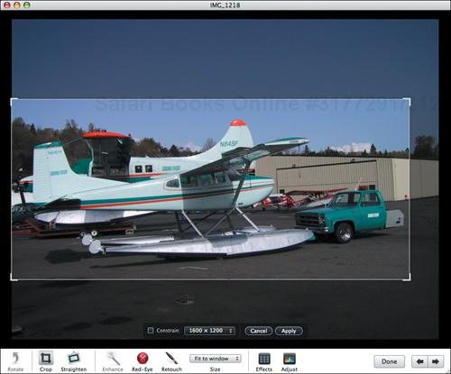 To select a portion of a photo, drag to create a selection rectangle. Move it by dragging it; resize it by dragging an edge or corner. Here I’ve created a selection rectangle with no specific proportion to focus on the seaplane and the odd truck.