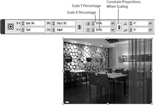 The Scale X Percentage and Scale Y Percentage fields in the Control panel show that the selected graphic is scaled to 50% of its original size. (The graphic was selected by clicking it with the Direct Selection tool.) The Constrain Proportions When Scaling button to the right of the fields is selected, which means the graphic’s proportions will be maintained if you change either of the scale values.