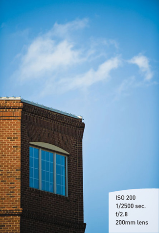 The predominance of the blue sky is balanced by the sky’s reflection in the window.