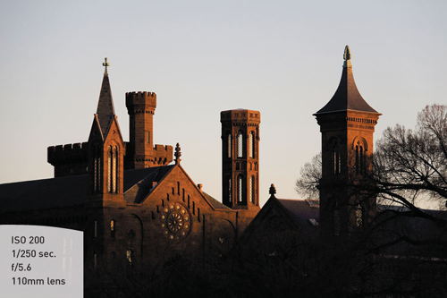 The warm glow of the Smithsonian Castle dominates the bottom two thirds of the frame, leaving no doubt as to what the main subject is.