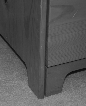 An angle view of the dresser's bottom corner