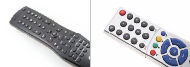 The remote control on the left does not have a clear visual hierarchy. The remote on the right at least highlights important functions with color, though the choice of green for a stop button is unfortunate.