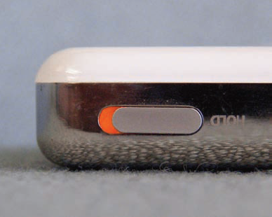 This iPod's "hold" button, which prevents accidental activation of other controls, uses a bright orange color to indicate that it is on.