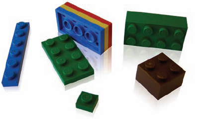 The LEGO System is an example of grid-based design in three dimensions. The base unit is a single-stud plate; everything is built up from there. Bricks are three plates tall and some number of studs long and wide. This ensures that everything fits together.