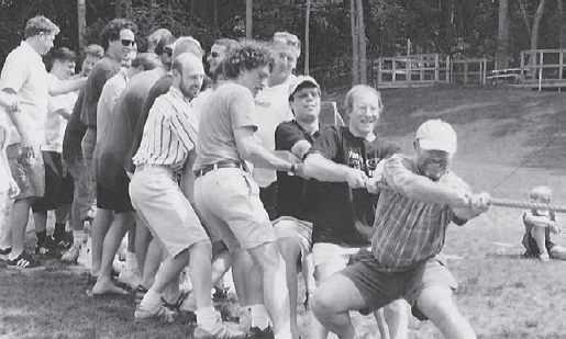 The founders and some original members of Revit Technology, having a tug-of-war at a release party, circa 2000