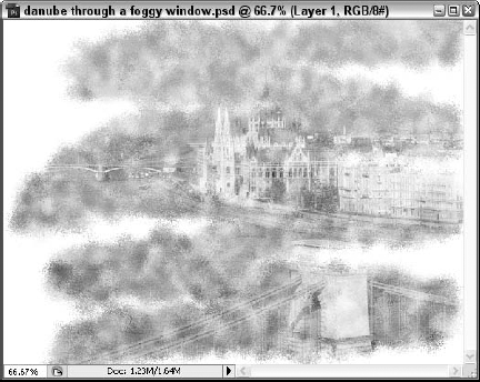 Painting on a layer mask with a spatter brush creates the effect of looking through a foggy window.