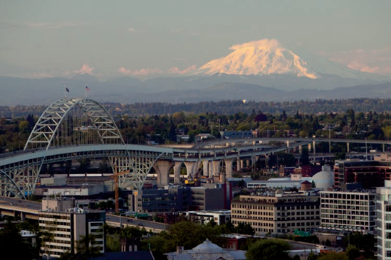 In this daylight shot, the city of Portland in the foreground is rather cool or bluer than the mountain, which takes on a warm alpenglow cast from the setting sun. Exposure: ISO 2500, f/8, 1/400 second.