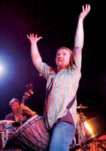 Selective focus keeps Tap Water percussionist Rudy Slizewski sharp and bassist Wes Elliott softly out of focus in the background. Exposure: ISO 400, f/5.6, 1/800 second.