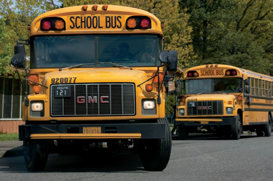 Buses pull away from the curb as the school day ends. I focused on the front bus and selected f/8 to give me adequate sharpness throughout the range of the scene. Exposure: ISO 400, f/8, 1/640 second.