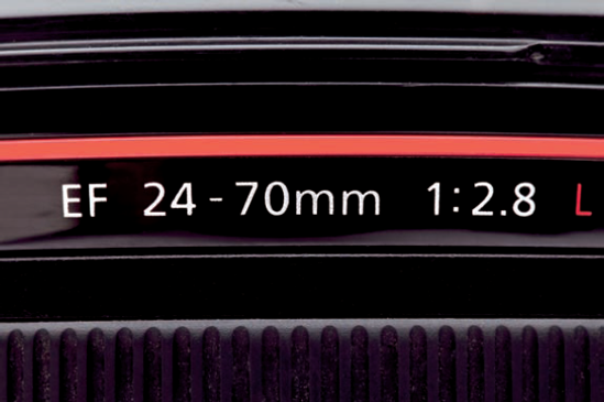 This 24-70mm constant aperture zoom lens shows its designation as such on the side of the lens barrel. It maintains an available aperture of f/2.8 throughout its zoom range.