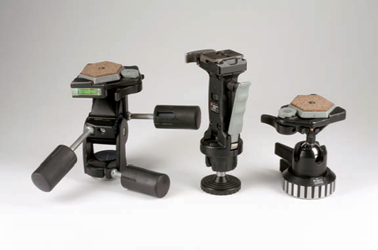 The three types of tripod heads I use when shooting landscape and nature photos all have quick-release mounting plates. The three-way pan/tilt head (on the left) allows individual adjustments of pan, tilt, and height positions. The joystick (in the middle) and the ball head (on the right) provide quick adjustment of all axes to compose and shoot quickly changing compositions.