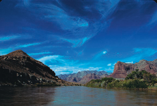 The polarizing filter, when rotated properly, adds contrast, yields deep blue skies, reduces reflections from surface glare of foliage, and saturates landscape colors, as in this shot from the Green River, Utah. Exposure: ISO 100, f/11, 1/250 second.