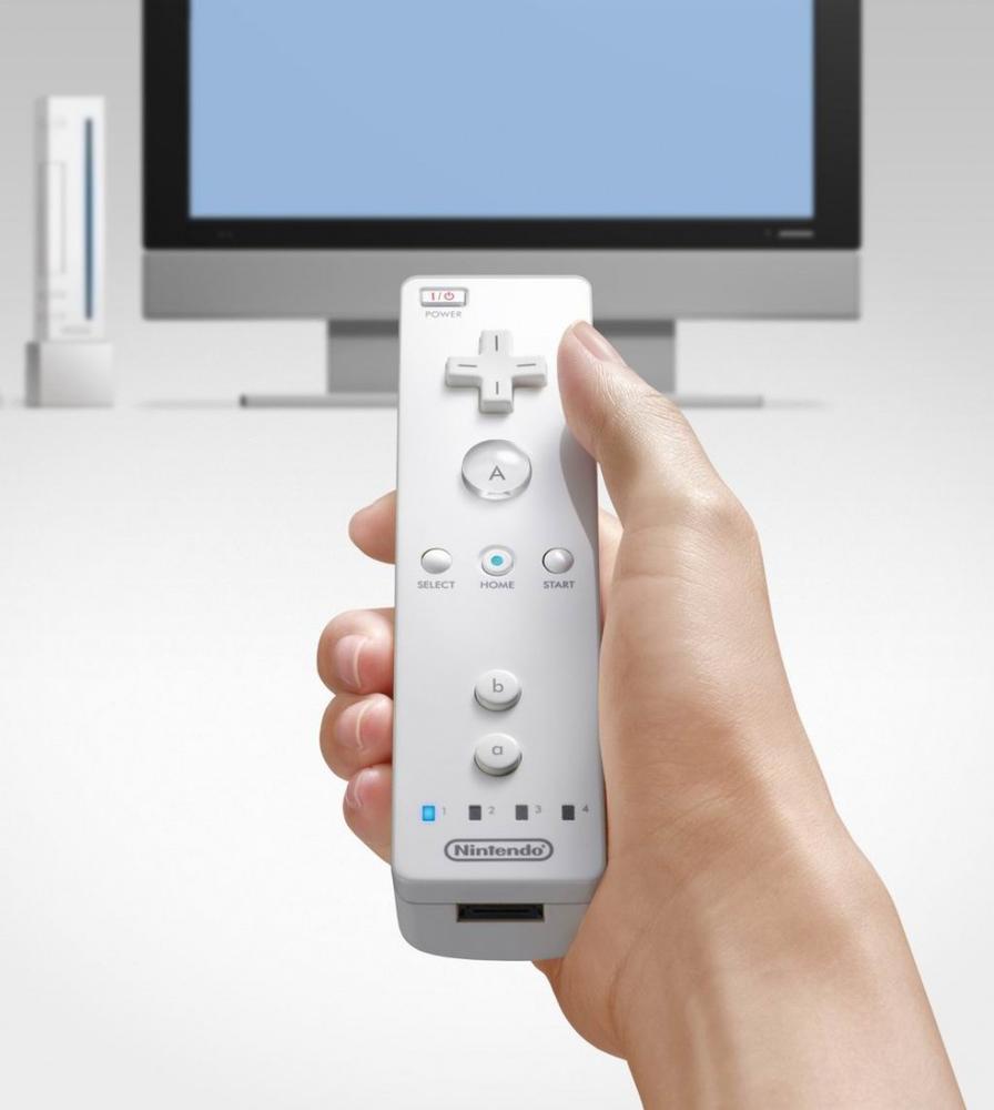 The Wiimote works with a stationary sensor bar on top of the TV screen, allowing users to use the device to Point to Select items on-screen. Courtesy Herman Yung.