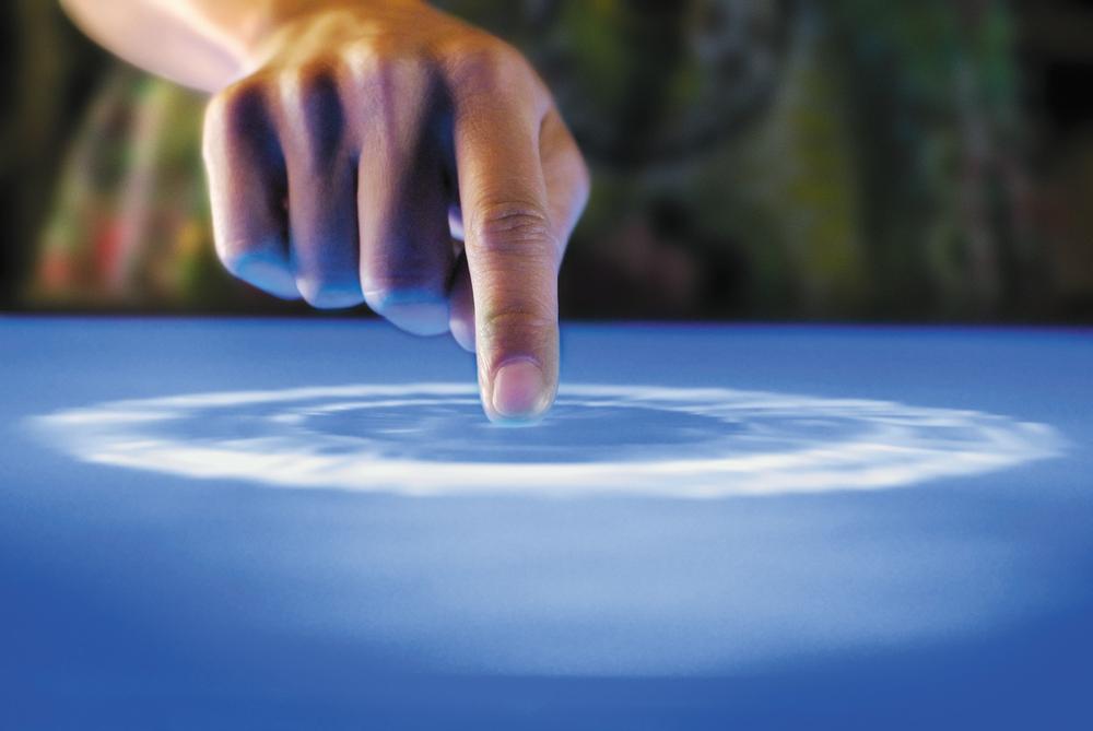 Microsoft's Surface has an excellent attraction affordance to lure users into touching its, well, surface: water. It looks as though you can touch the water, and so many people do, triggering the system to wake up from idle mode. Courtesy Microsoft.