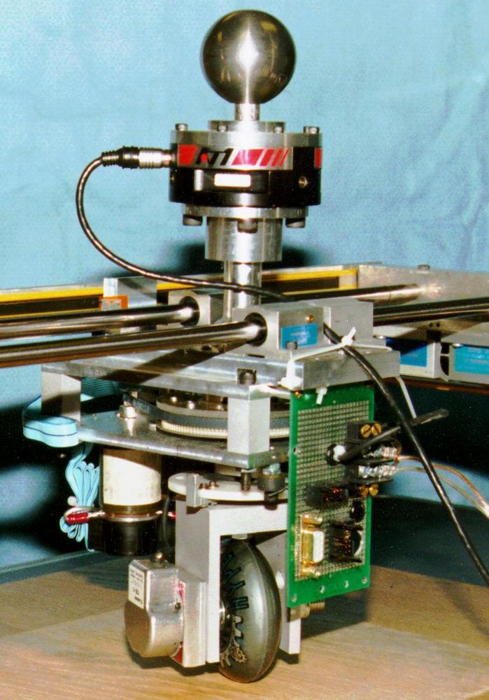 This "unicycle" cobot, consisting of a single wheel steered by a motor, demonstrates two essential control modes: "free" mode in which users can steer the wheel wherever they want, and "virtual surface" mode in which the cobot confines the user's motion to a software-defined guiding surface. Courtesy Northwestern McCormick School of Mechanical Engineering.