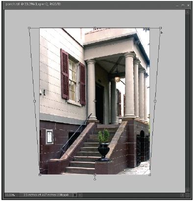 Here’s an example of how you’d use the Skew command to pull a building upright. To apply the Transform commands, make sure you can reach the handles on the corners. It helps to enlarge your image window far beyond the size of the actual image to give yourself room to pull. To enlarge the window, just drag the window’s corner, or better yet, on the far right of the menu bar (to the left of the Close button), click the little square to get into Maximize view.