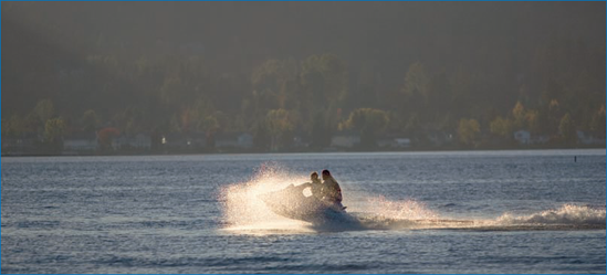 Jet skiing can be spectacular to shoot late in the day during sunny weather. I shot this image directly into the sunlight on Lake Sammamish near Seattle at a shutter speed of 1/8000 second to create a silhouette effect with water spray.