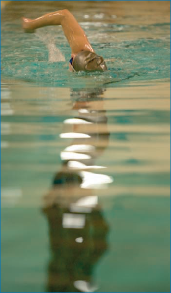 RAW format gave me the control I needed for this swimmer photo, taken without a flash to emphasize the ambient reflections on the water.