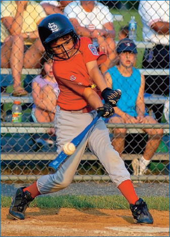 This photo not only shows a youth player in a very complimentary pose, but it also caught the ball at just the right moment.: ©Joy Absalon