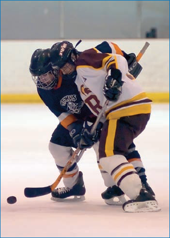 Shooting ice hockey involves making sure your exposure is set properly for the players first and the ice second.: © Joy Absalon