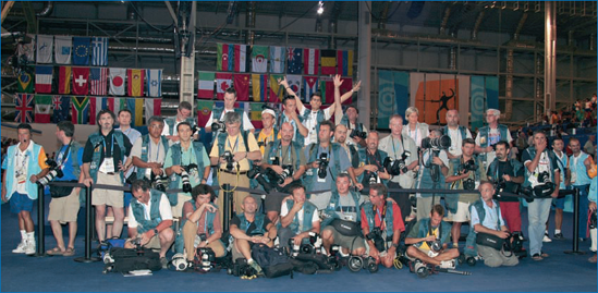 Virtually digital: Athens 2004 Olympic photographers after a gold-medal fencing final and awards ceremony. The author is third from the left. © "Panos," member of the Greek Olympic media support staff.